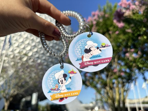 Mickey and Minnie Mouse themed Disney gift card wristlet for the 2024 Epcot International Food and Wine Festival.