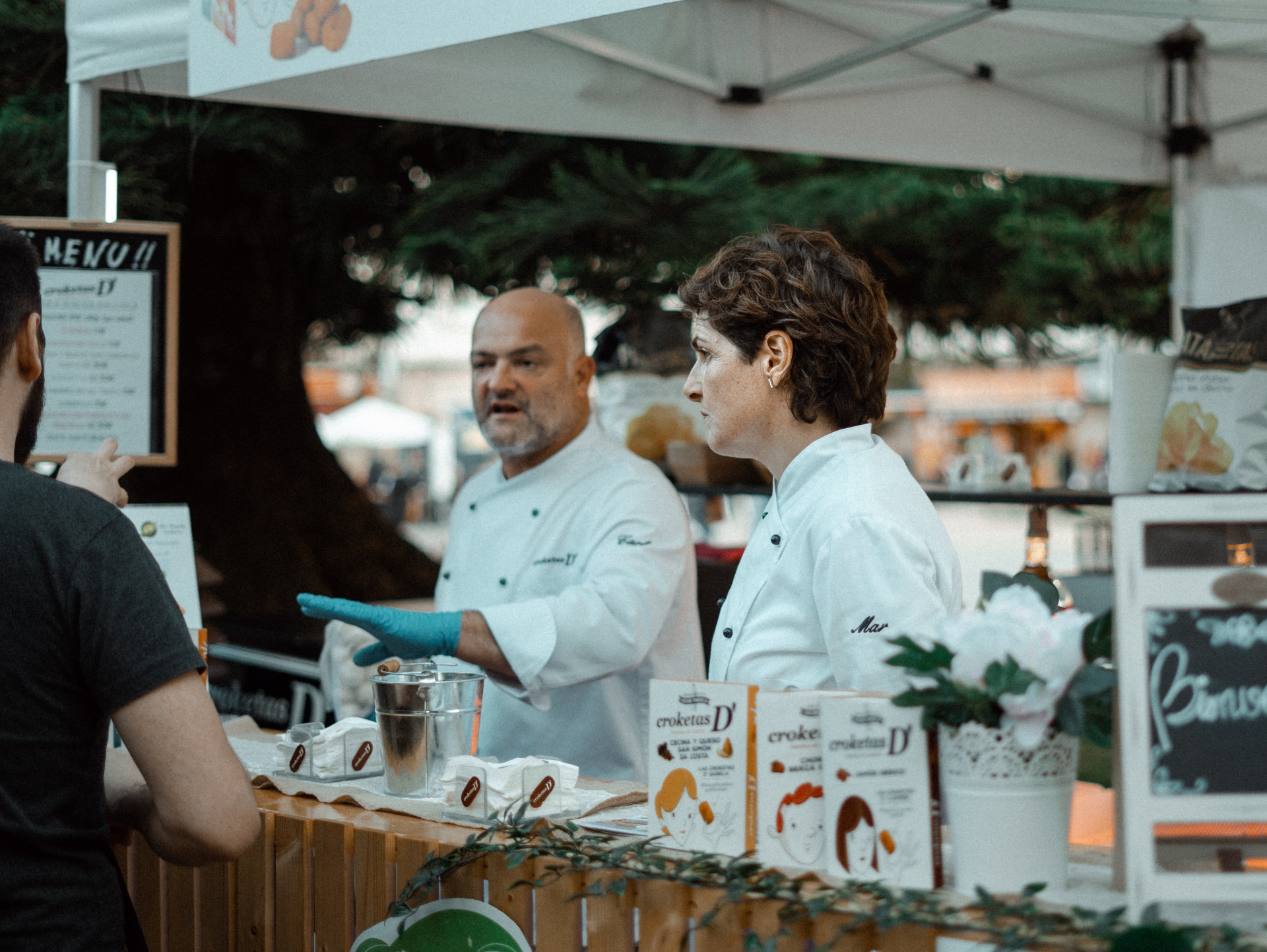 A vibrant food truck event with various trucks and people enjoying food, illustrating the dynamic environment of food truck businesses.