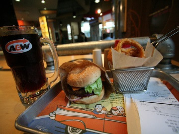 An A&W restaurant menu board displaying classic fast food items and prices.