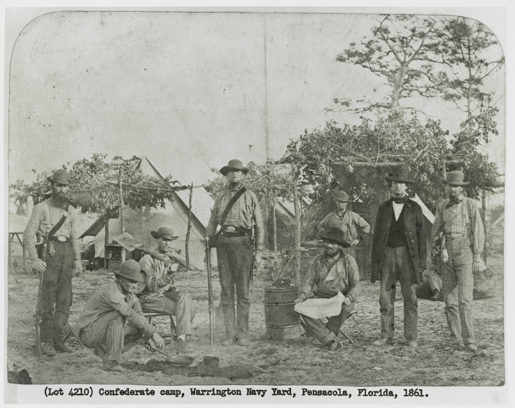 Confederate soldiers in their encampment during the American Civil War, highlighting the logistical challenges of food supply for the Confederacy.