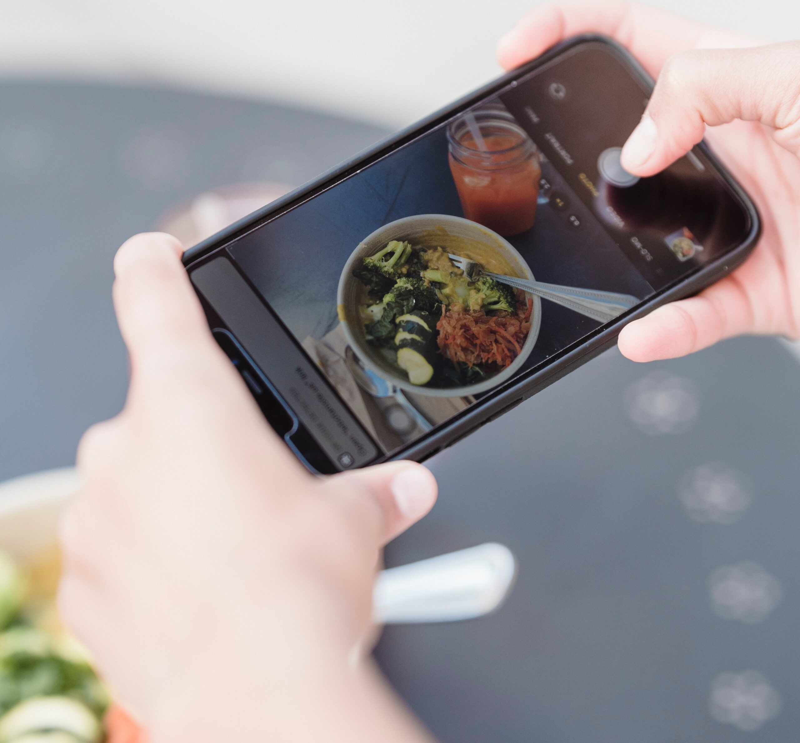 Capturing a clean eating meal for social media, highlighting the influence of platforms like Instagram on food trends and healthy eating.