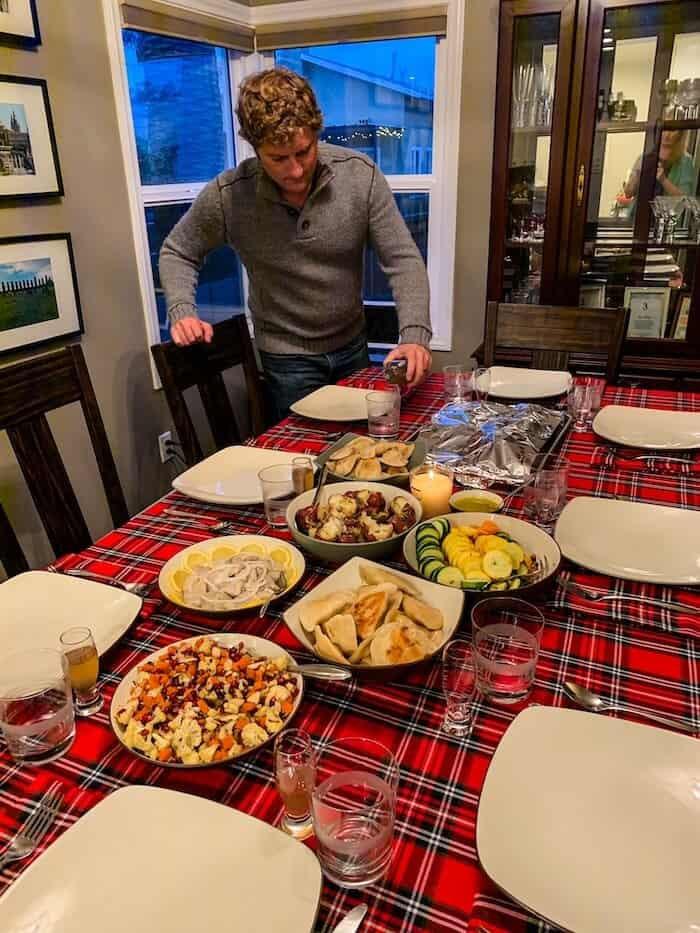 A man prepares an evening of Polish food at the Wigilia meal, a traditional Christmas Eve meal that includes pierogi and pickled herring.