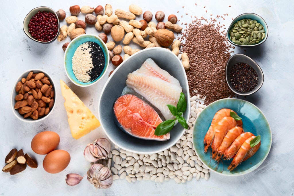 Discover phosphorus-rich foods: an assortment of healthy food sources high in phosphorus, featuring nuts, seeds, salmon, eggs, and cheese, vital for bone health and overall nutrition.