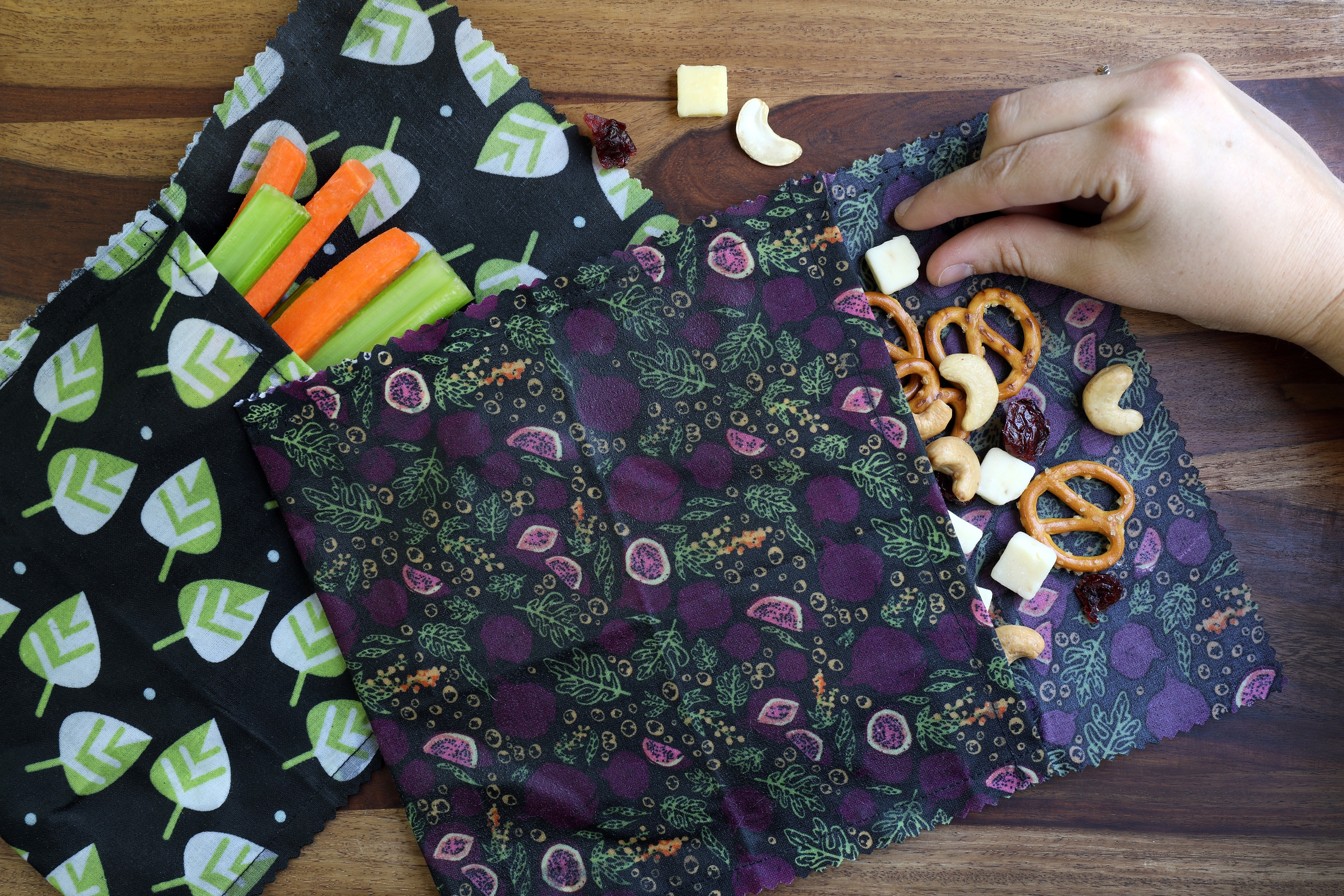 Reusable beeswax food wrap pouch filled with dried fruit, demonstrating a practical use for homemade food wraps.