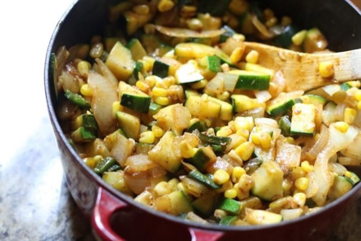 A bowl of vibrant Mexican rice, garnished with fresh cilantro.