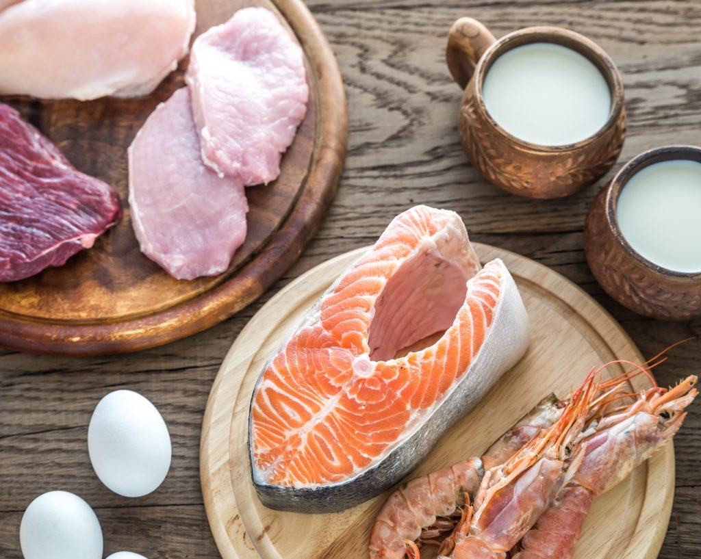 Various foods rich in vitamin B12, such as salmon, eggs, milk, and cheese.