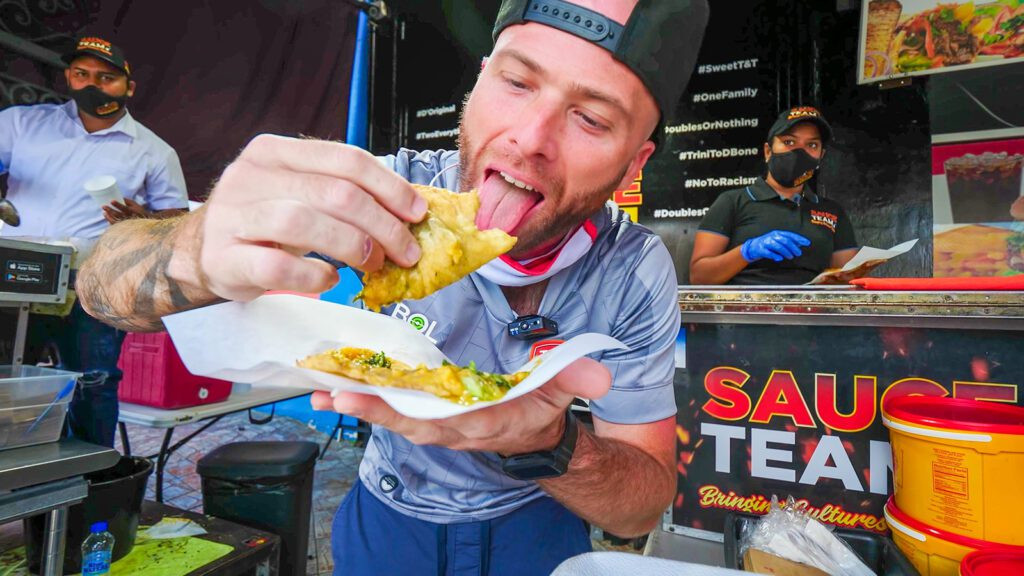 David Hoffmann eating messy Trinidad doubles at Sauce Team on the island of Trinidad | Davidsbeenhere