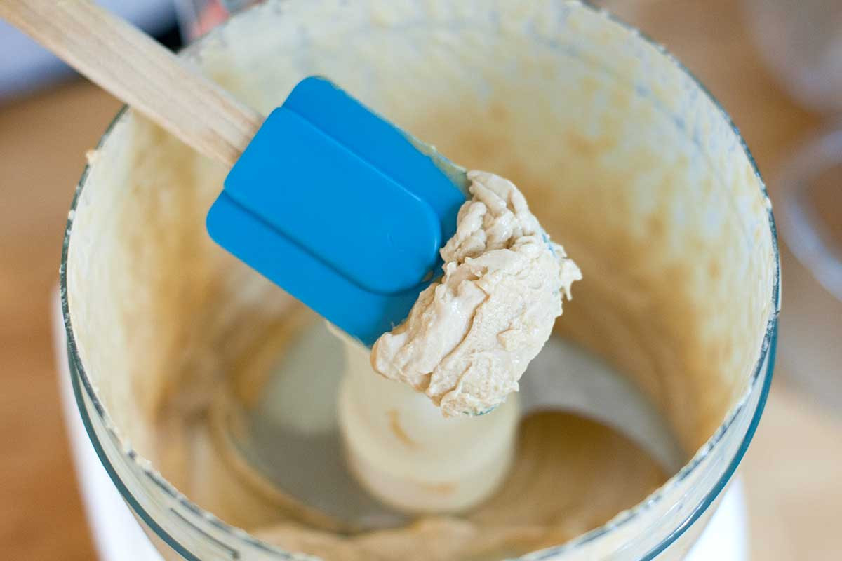 Hummus after processing, showing a creamy, smooth texture.