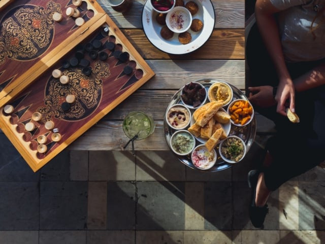 Assortment of traditional Middle Eastern dishes including hummus, tabbouleh, and falafel