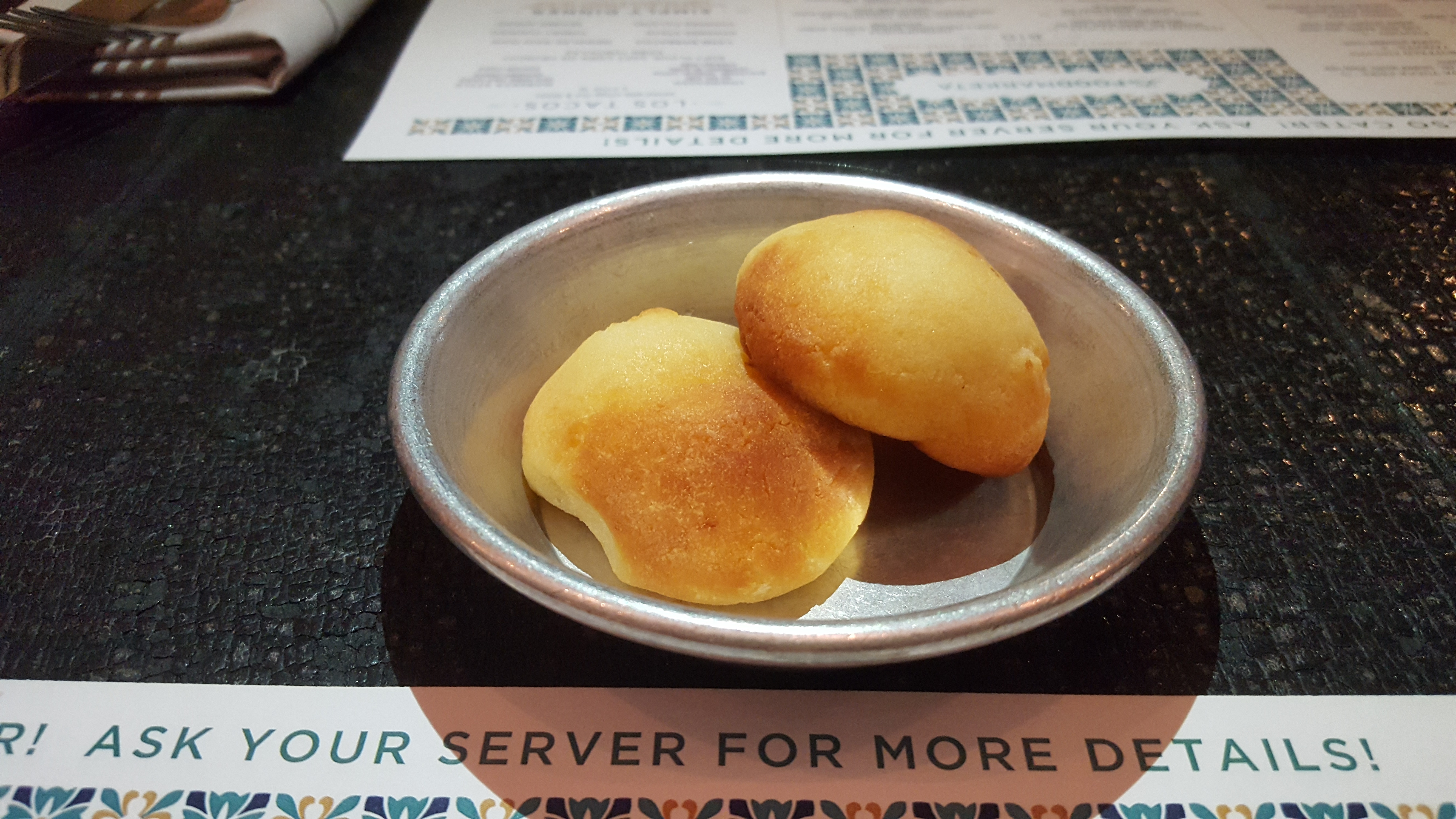 Close up of two delicious cheesy rolls on a plate