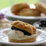Blackcurrant jam and scone close up