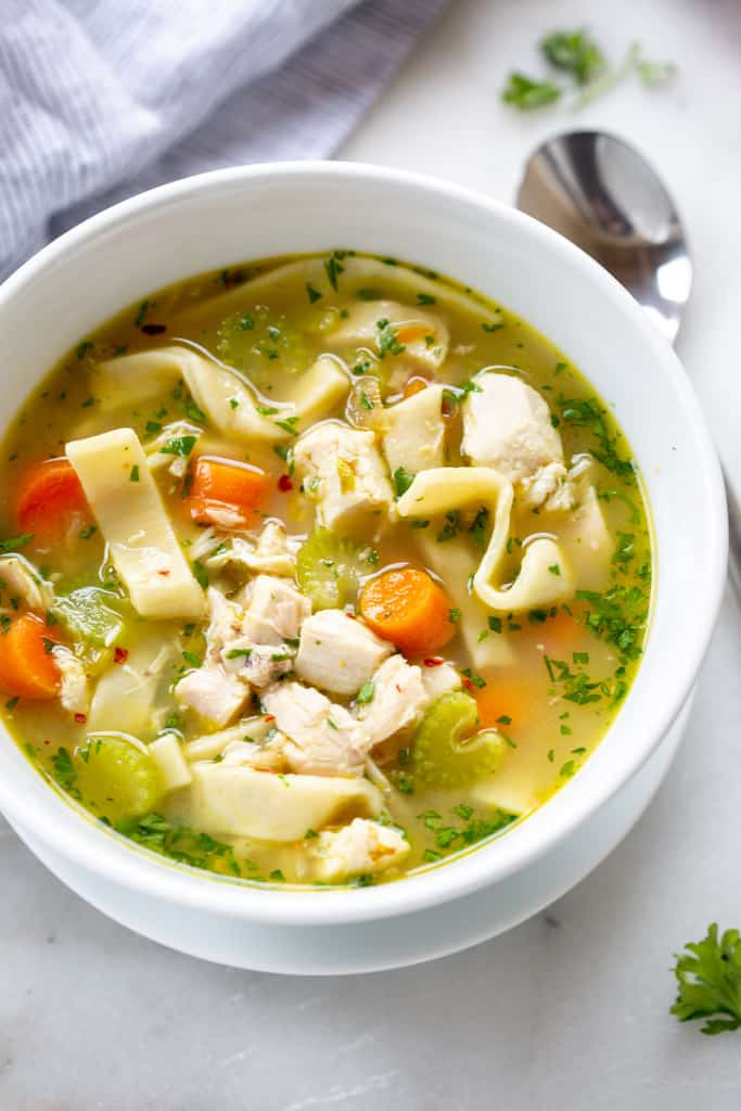 Bowl of chicken noodle soup with visible noodles and chicken pieces