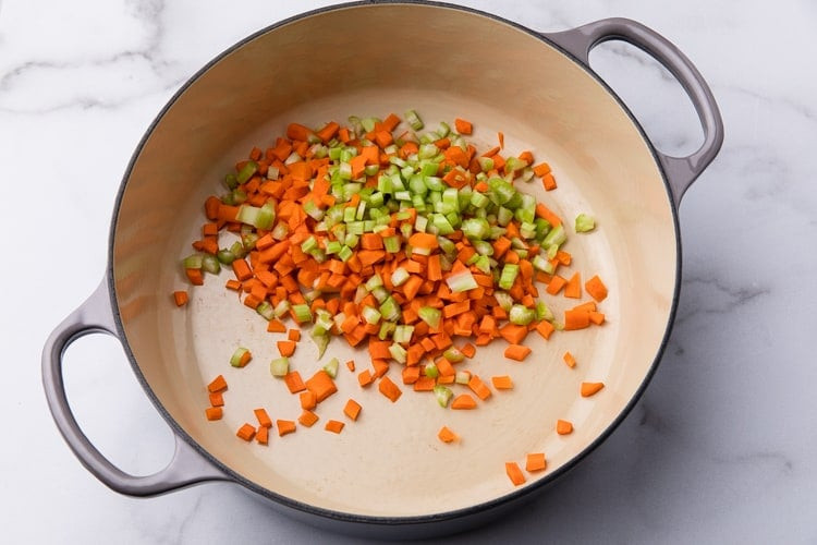 Sautéed celery and carrots in a pot