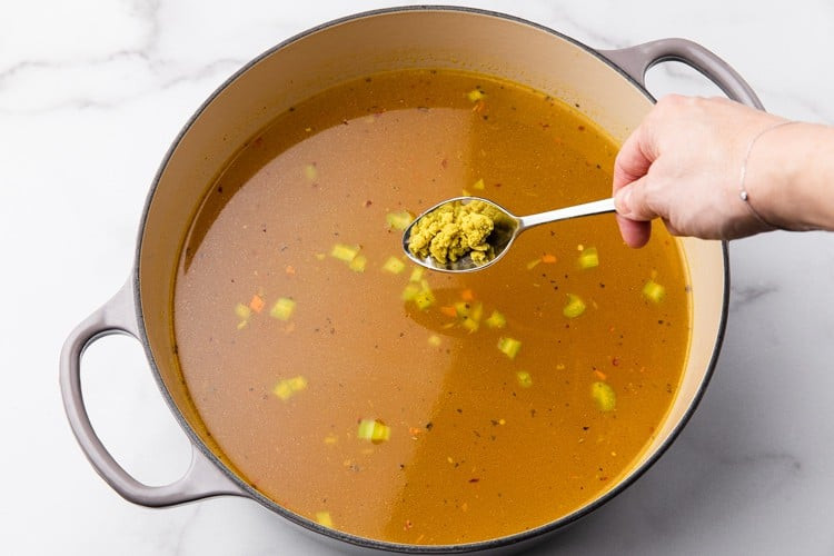 Chicken stock with spices in a pot