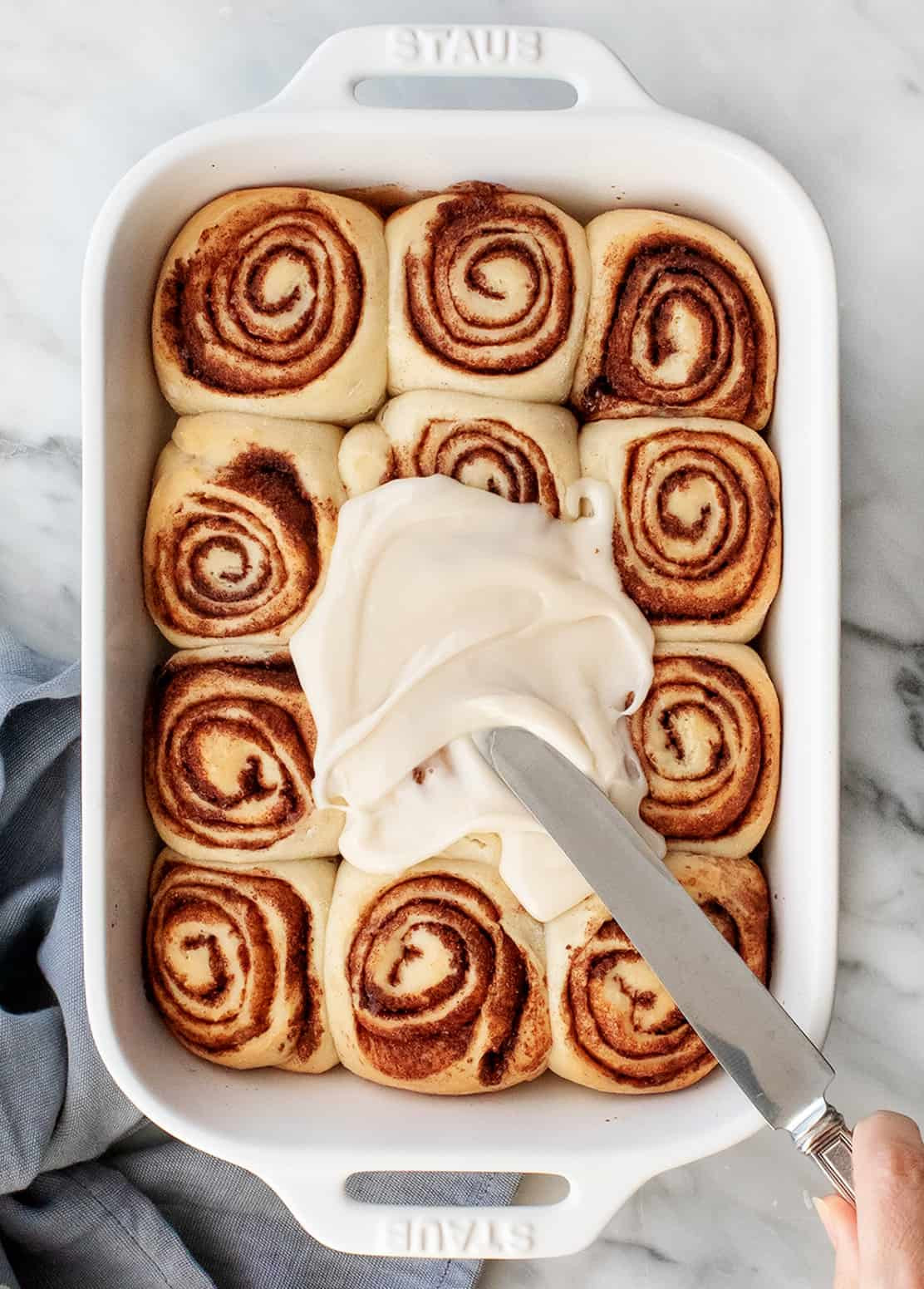 Cinnamon rolls, soft, gooey, and topped with a sweet vanilla glaze, perfect for family brunch