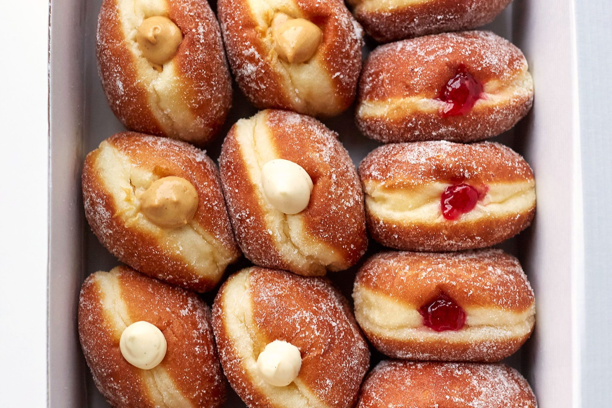 Jam doughnuts, or Sufganiyot, are a quintessential Hanukkah treat, symbolizing the miracle of the oil that lasted for eight nights.