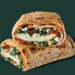 Egg white filling with spinach, feta and sun-dried tomato cream cheese inside a wholewheat wrap