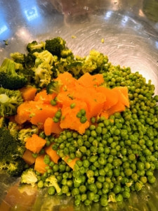 A mix of peas, broccoli, and pumpkin.