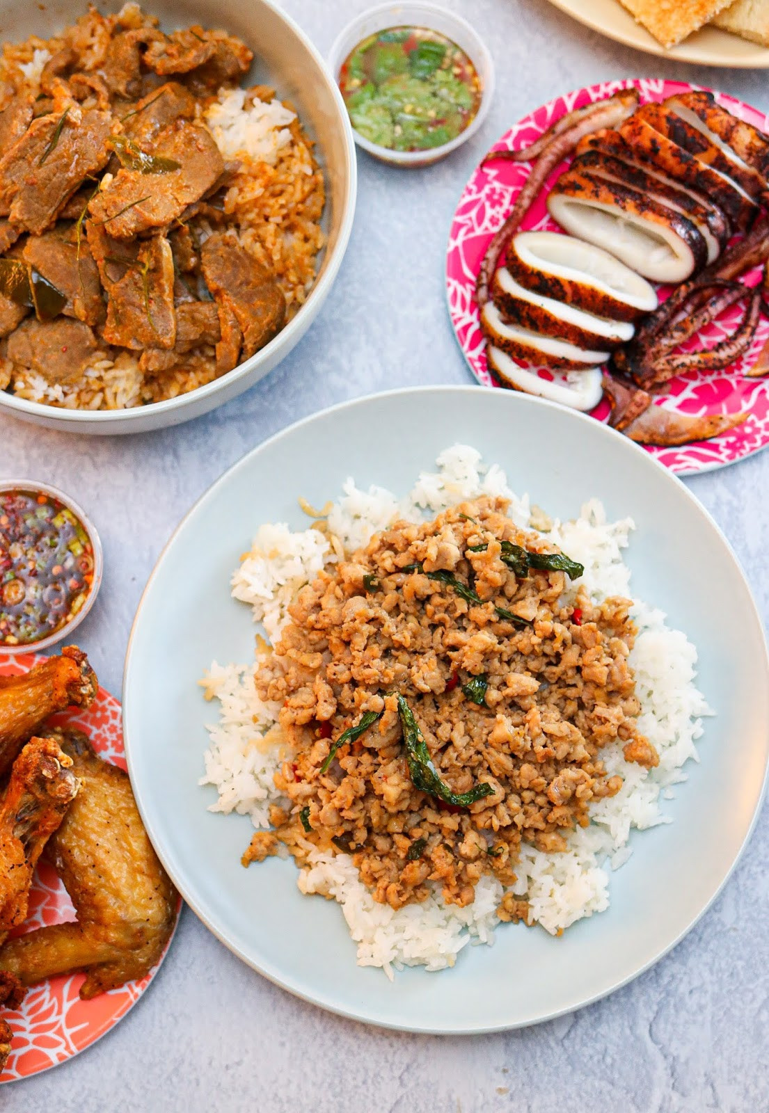 Savor the aromatic Khao Panaeng Neua at JJ Thai Street Food, a traditional stewed Panang beef curry served over Thai jasmine rice, a delightful and comforting dish