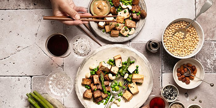 A balanced macrobiotic meal featuring tofu and various vegetables