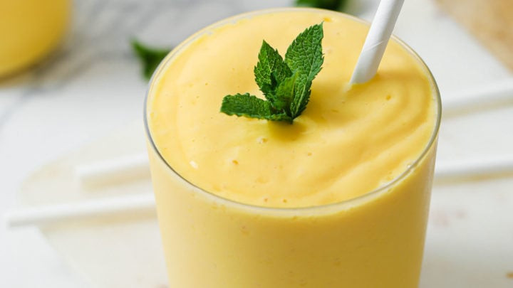 Glass of Mango Lassi with Straw