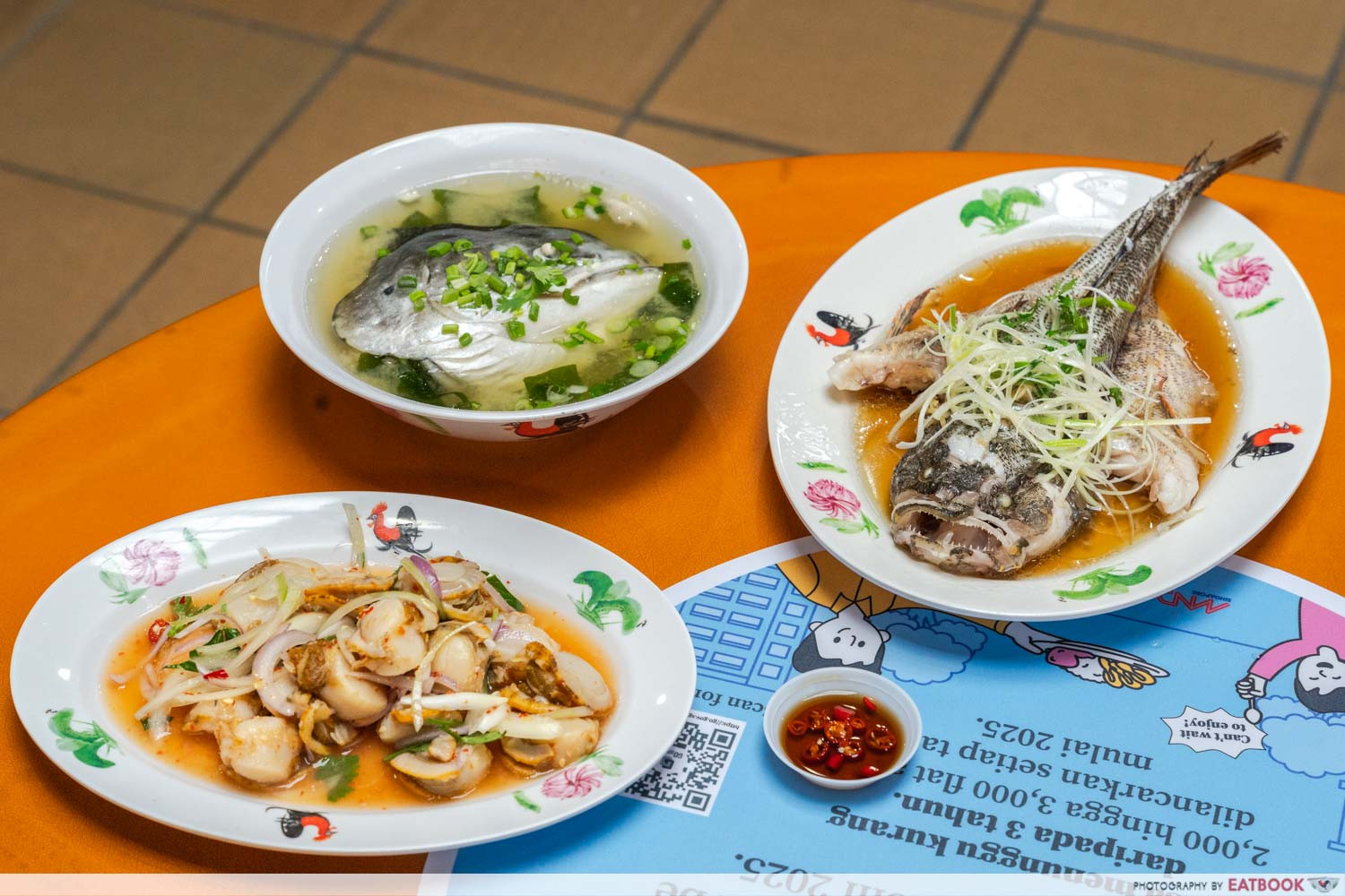 Affordable seafood dishes like HK-Style Steamed Red Grouper are available at Fish Village