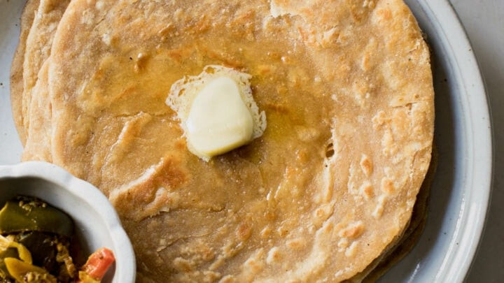 Stack of Paratha with Butter and Achaar