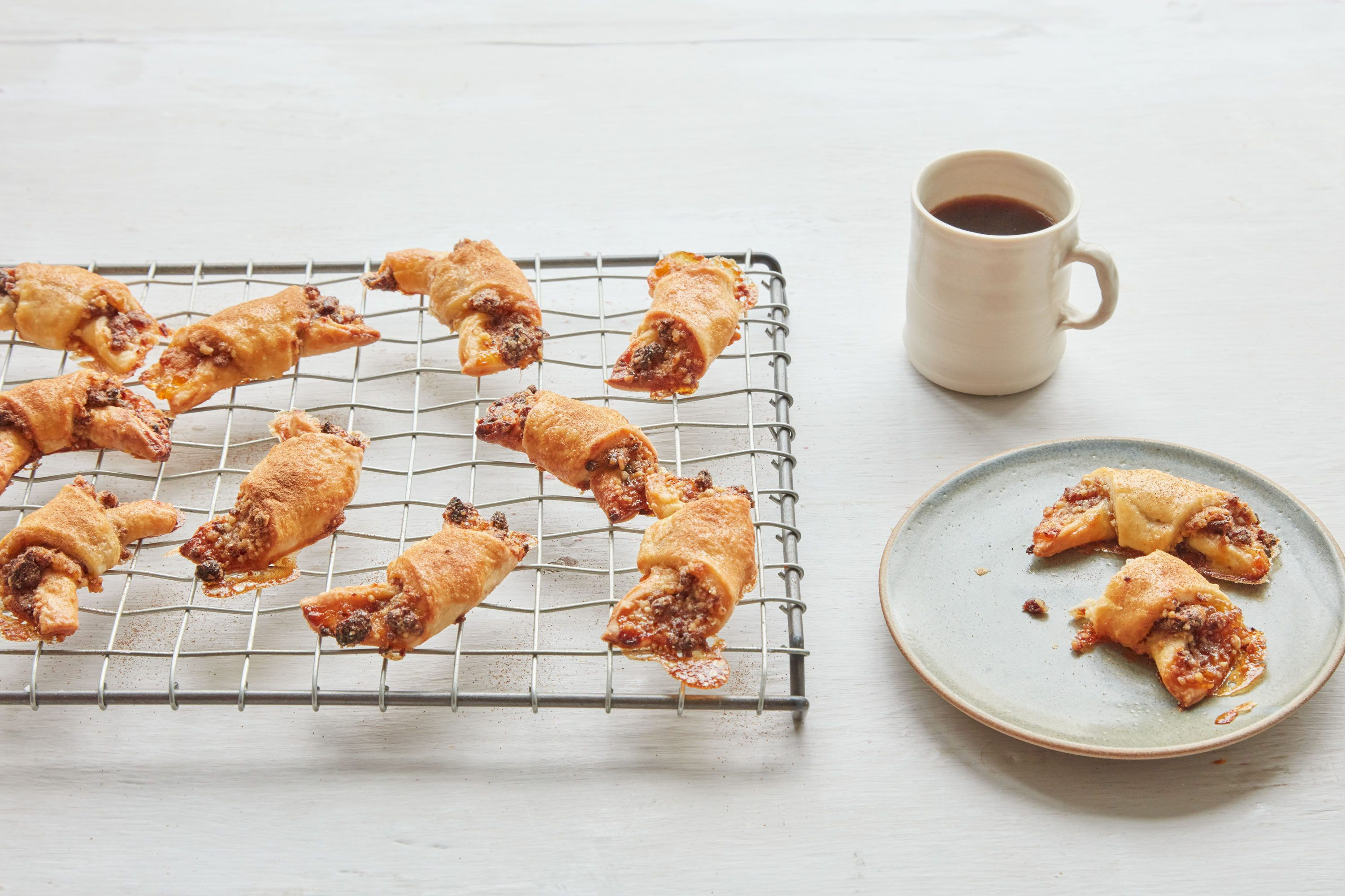 Rugelach are crescent-shaped cookies with a cream cheese pastry and traditional filling of dried fruits, walnuts, and cinnamon, perfect for a Hanukkah treat.
