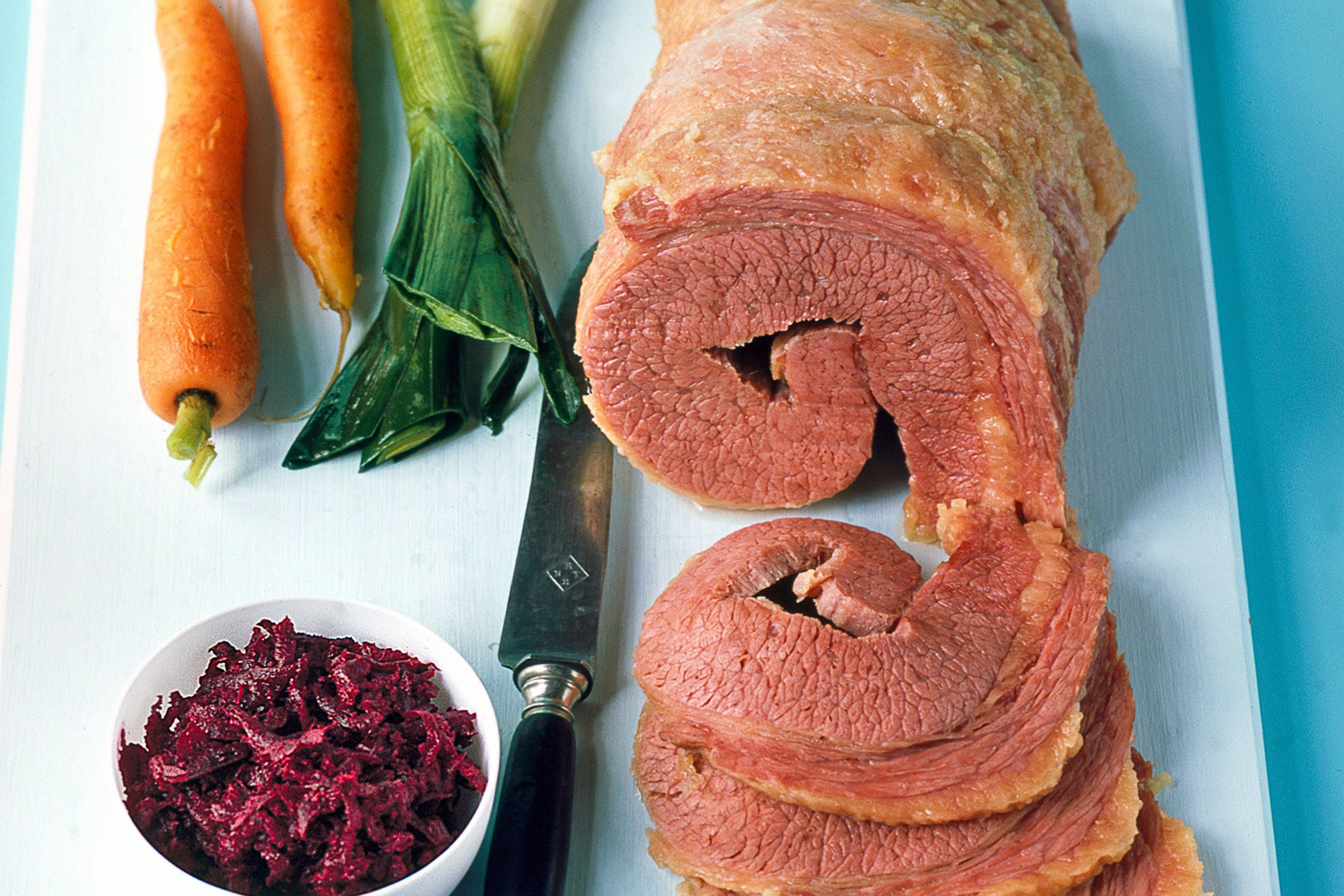Salt beef with beetroot relish provides a savory and tangy contrast, perfect for pairing with latkes during Hanukkah celebrations.