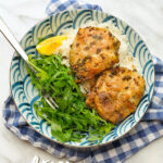 Baked chicken pieces marinated in garlic and herbs.